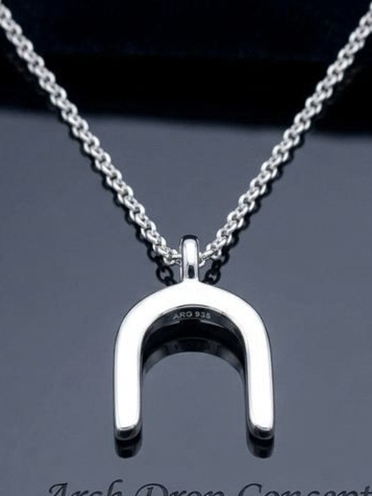 Sculptural Argentium 960 silver arch pendant, the kind of piece independent designers commission
