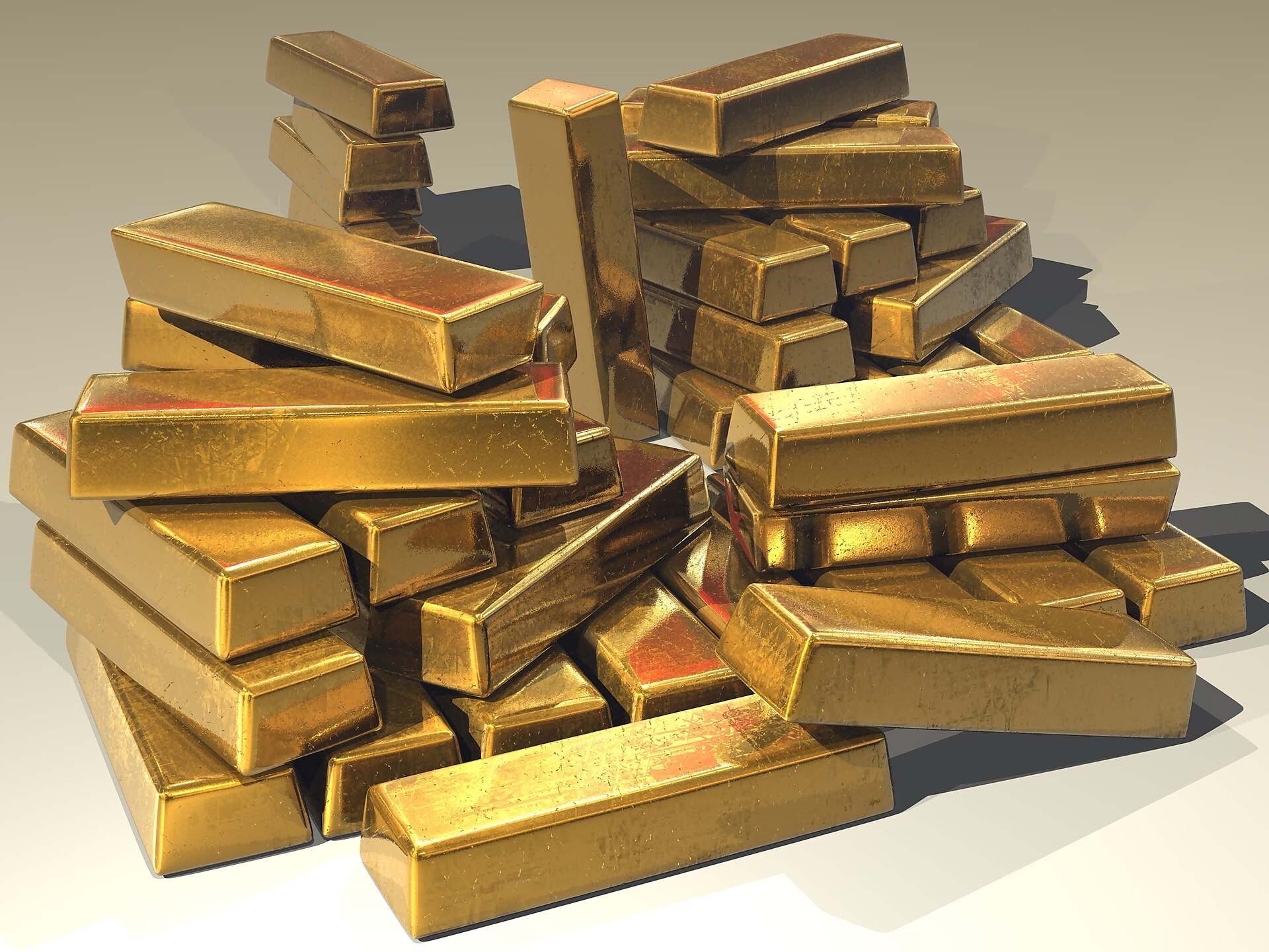 Gold bullion bars stacked