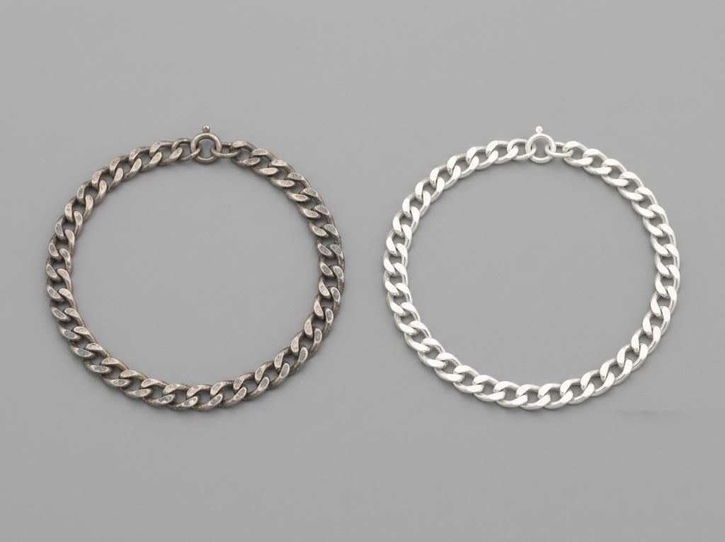 Two silver bracelets side by side, one darkened and patchy, one bright and even