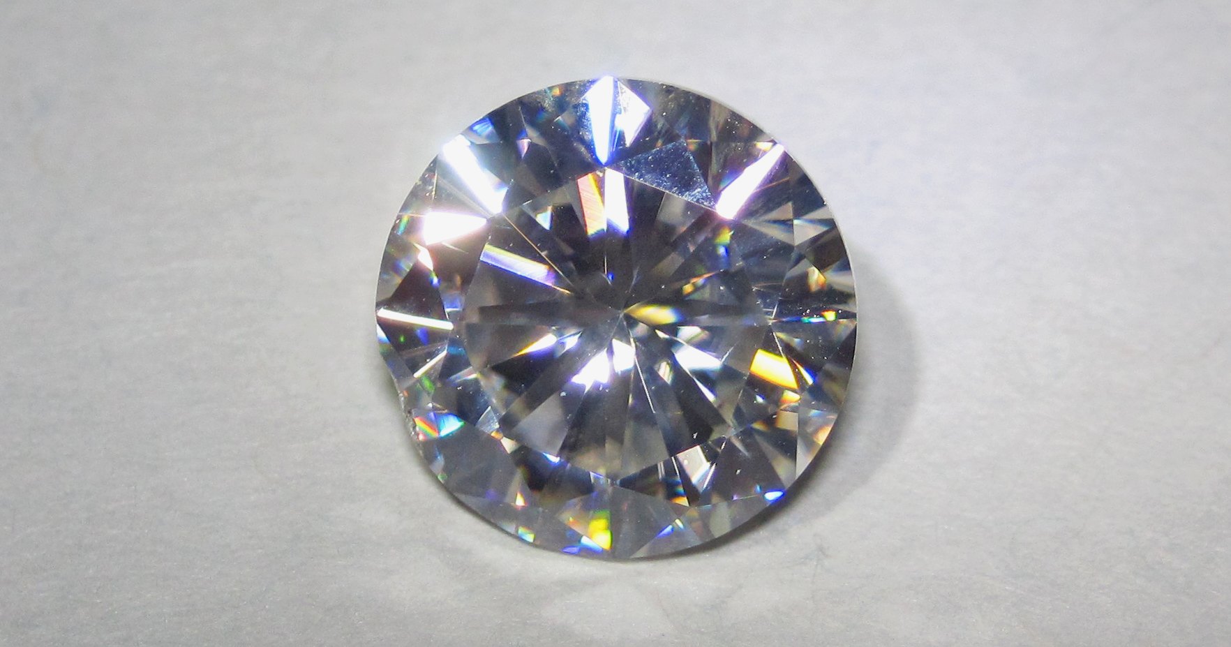 A loose round brilliant moissanite, silicon carbide