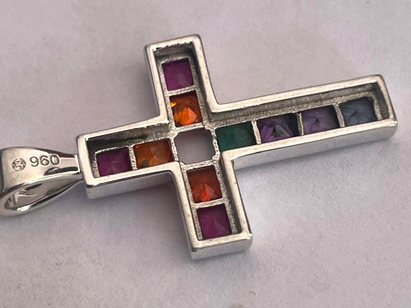 Argentium 960 silver cross pendant channel set with coloured square cut stones, made by Argentia