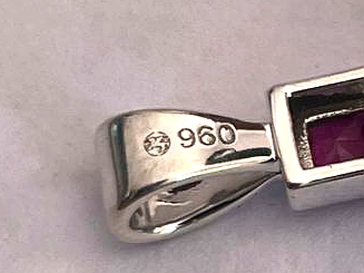 Winged Unicorn mark and 960 grade stamped on the bail of an Argentium silver pendant by Argentia